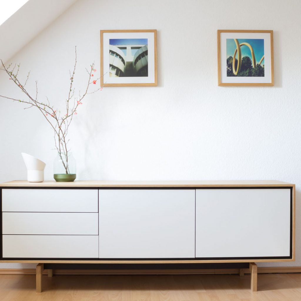 Interior design: Wooden, white sideboard in modern loft