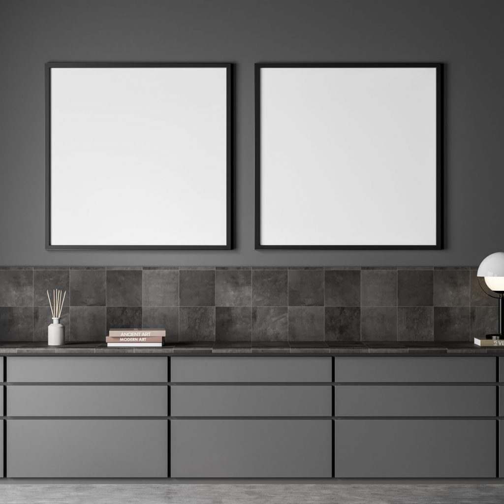 Two empty square canvases in dark grey corridor interior with extra large sideboard design, using tiled detail. Concept of modern wall art. Mock up. 3d rendering
